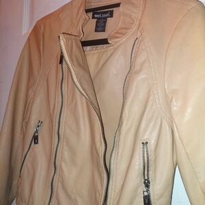 Wet-seal faux leather jacket w/ medium juniors fit. It has slight black stains.